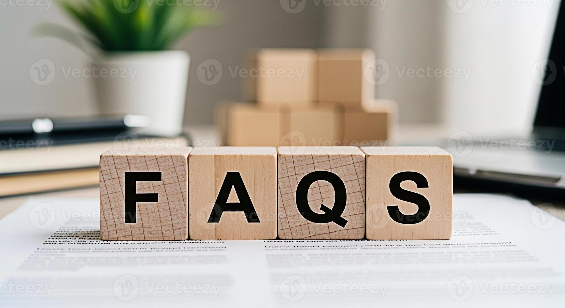 Wooden blocks displaying FAQs on a desk in a bright office setting symbolizing information access and customer support creating a sense of clarity and helpfulness for online resources and services photo