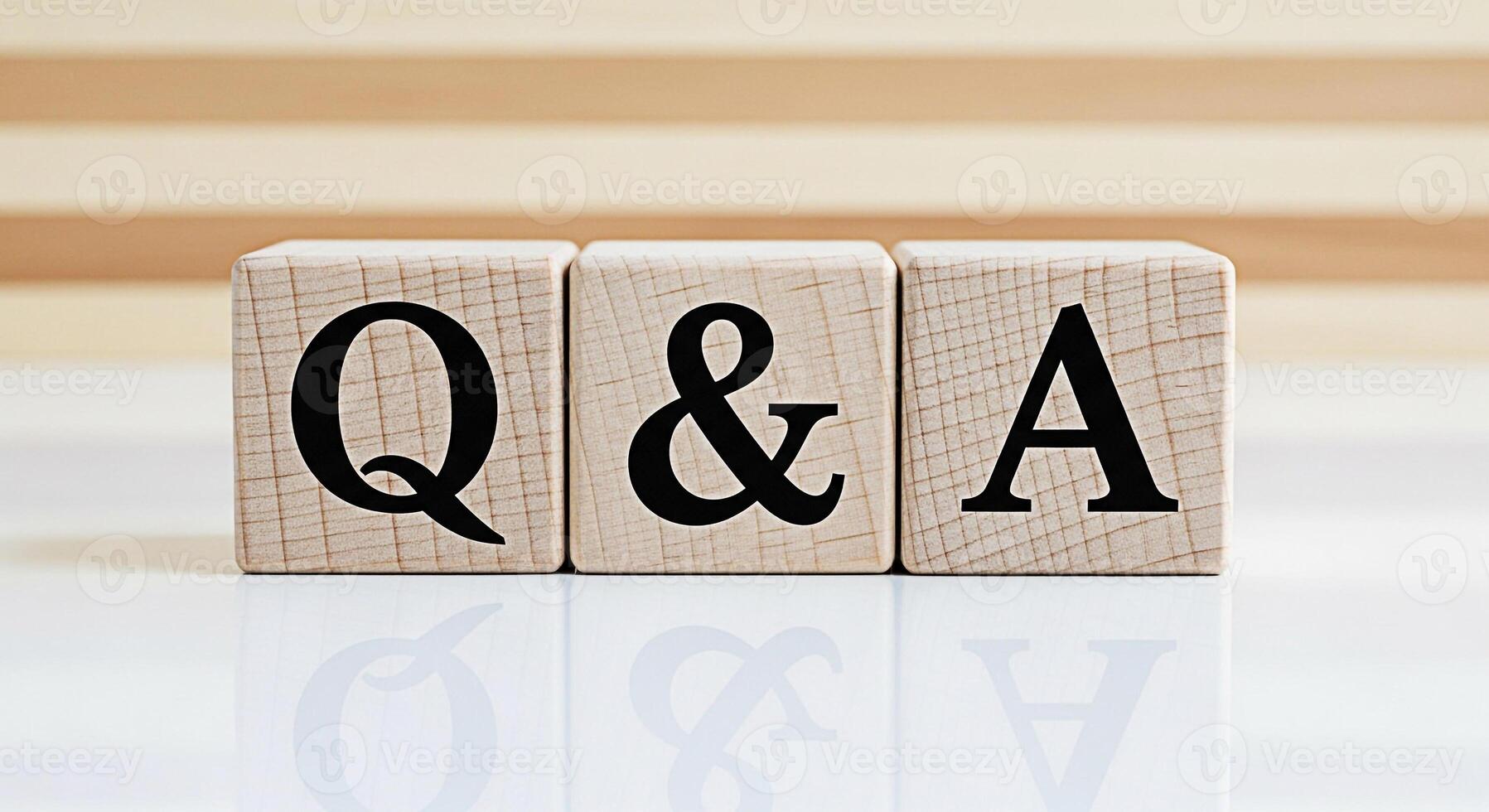 Wooden blocks displaying Q A on a reflective surface representing knowledge and information sharing in a clean bright environment symbolizing clarity and solutions to questions photo
