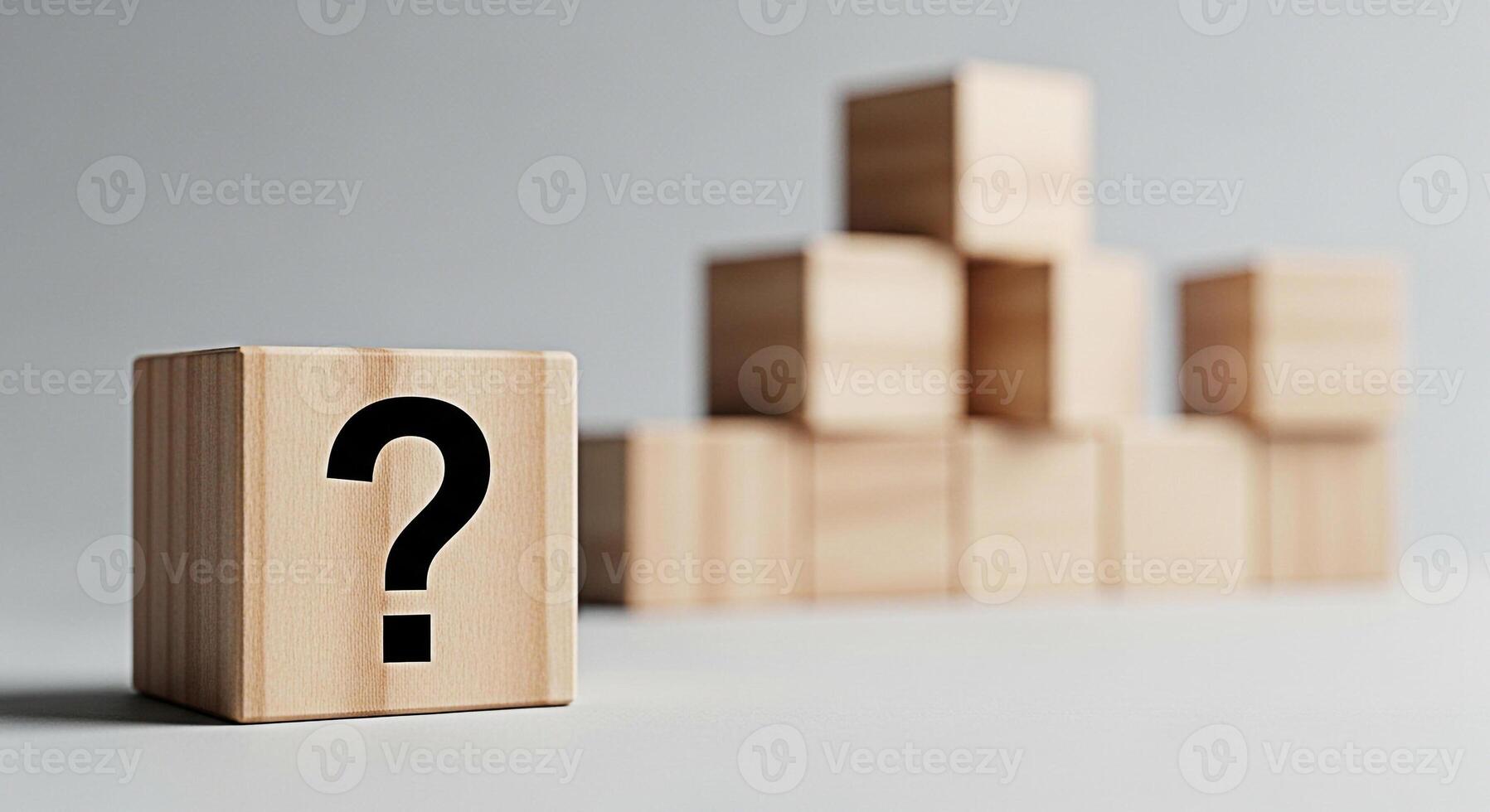 Wooden block displaying a question mark in a minimalist studio setting symbolizing uncertainty and the need for answers fostering curiosity and problemsolving skills in educational contexts photo