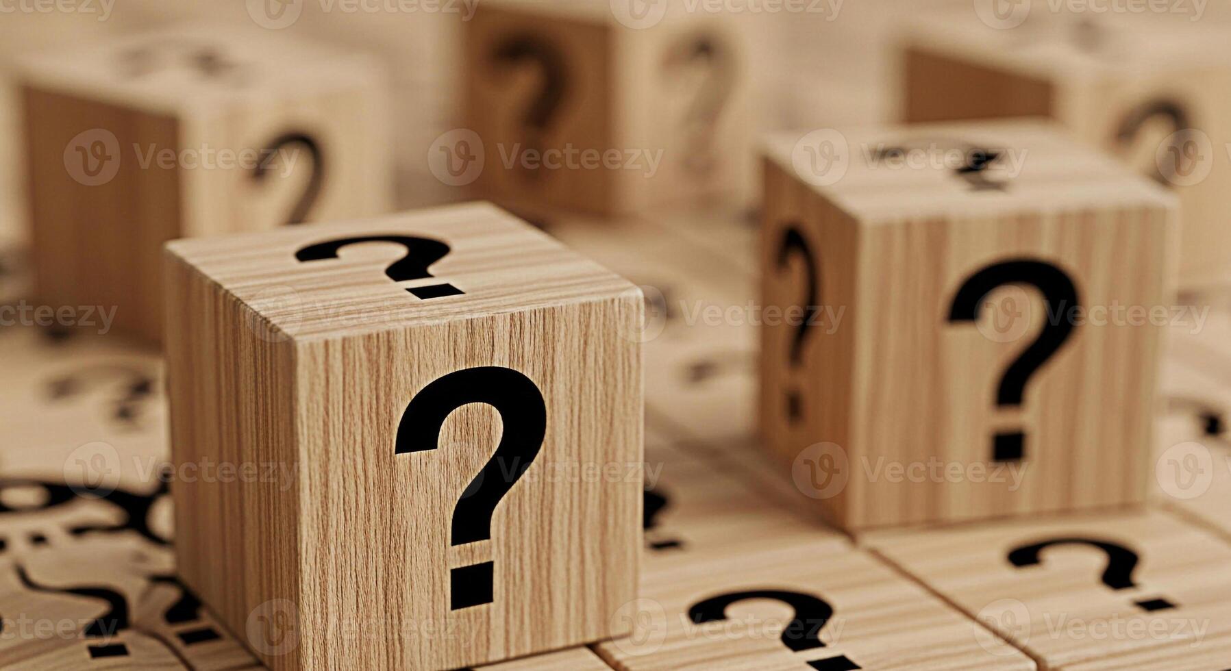 Wooden cubes displaying question marks on a wooden surface representing uncertainty and the need for answers creating a sense of curiosity and intrigue in a neutral setting photo