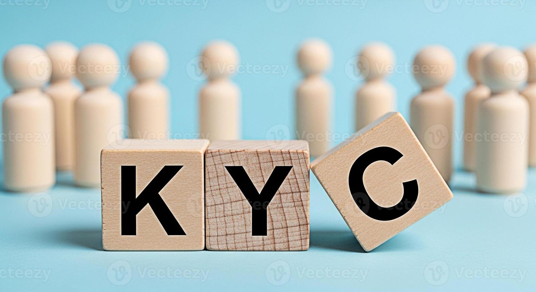 Wooden blocks displaying KYC in a business setting with a group of people representing the concept of compliance identity verification and regulatory requirements in a modern and trustworthy manner photo