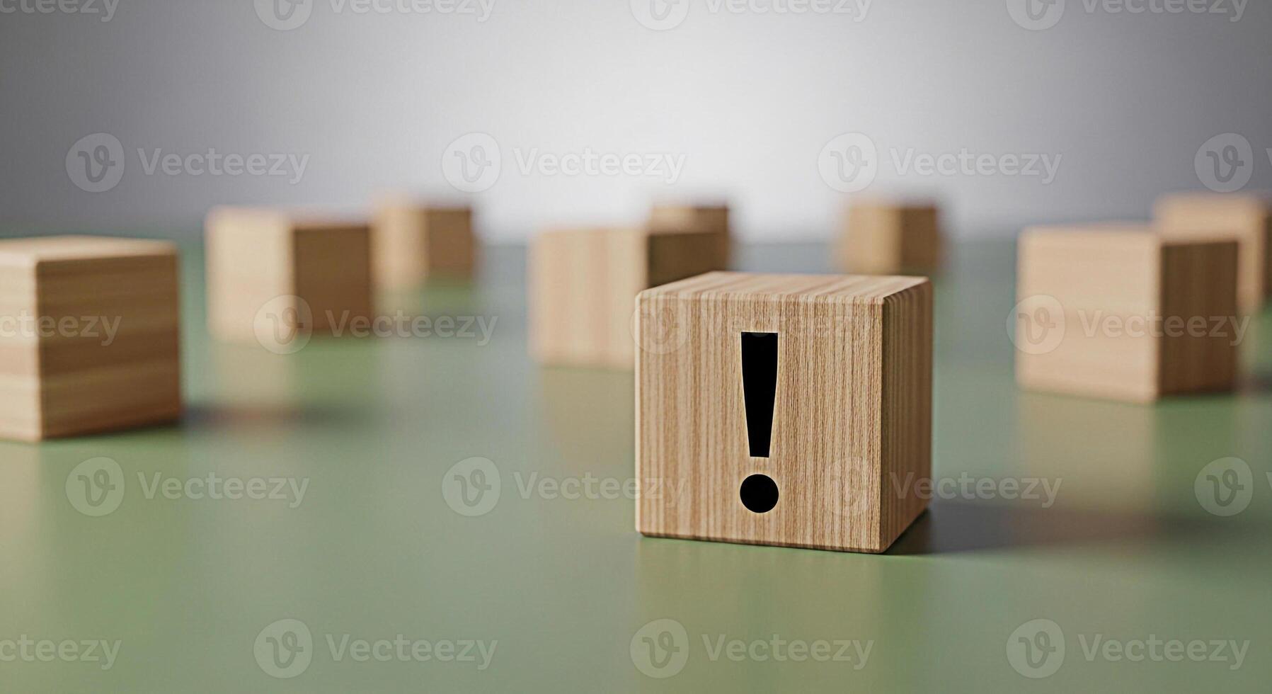 Wooden block displaying an exclamation mark on a green surface surrounded by other blocks creating a sense of urgency and importance in a minimalist and clean environment emphasizing attention to deta photo