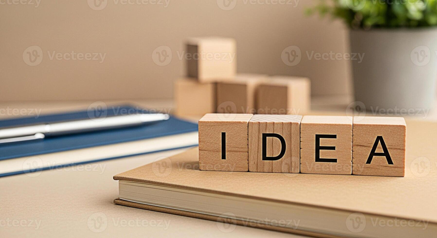 Wooden blocks spelling IDEA rest on a notebook in a bright minimalist workspace inspiring creativity and innovation for business planning and problemsolving with a fresh modern aesthetic photo