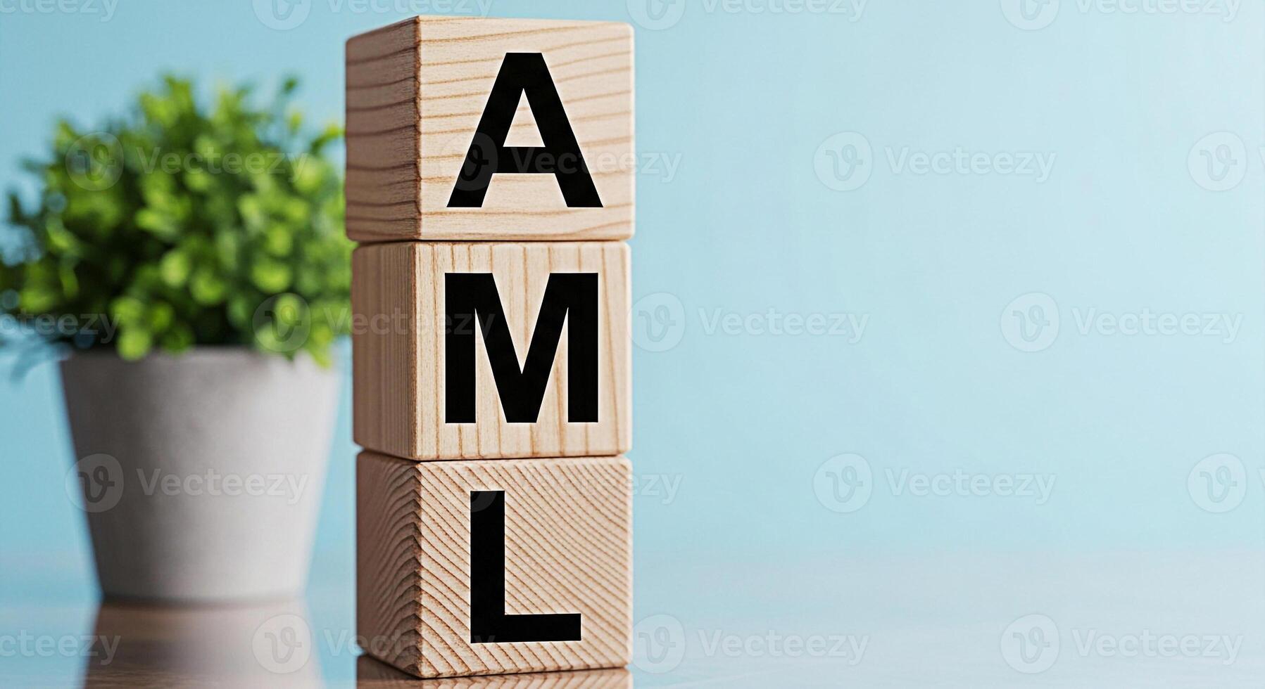 Wooden blocks displaying AML on a table in a bright studio representing AntiMoney Laundering compliance and financial regulation with a focus on preventing illicit financial flows and maintaining inte photo