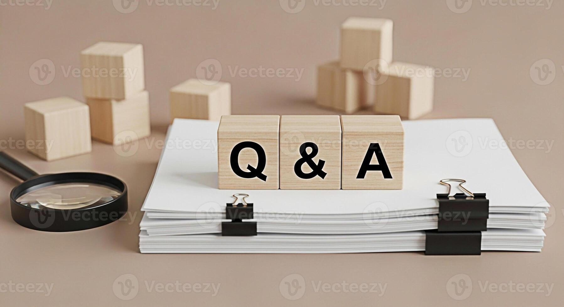Wooden blocks displaying Q A on a stack of white papers with a magnifying glass symbolizing research and information gathering in a neutraltoned office setting conveying a sense of clarity and underst photo