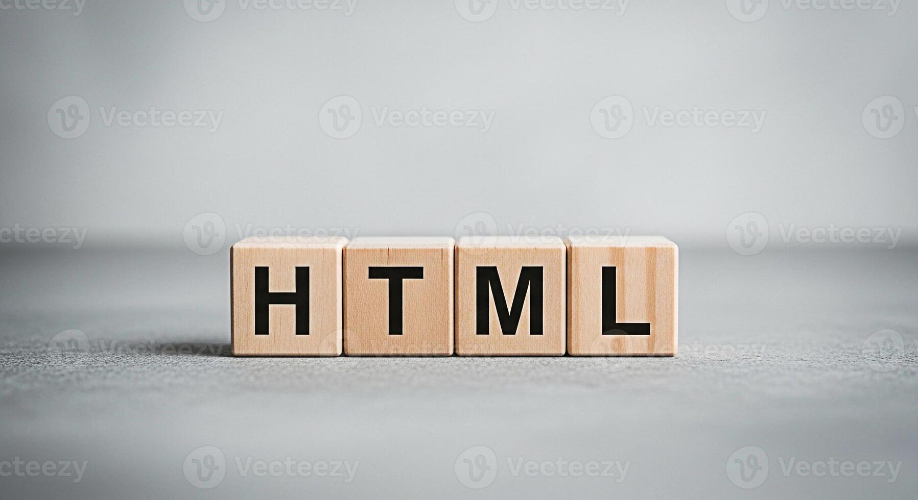 Wooden blocks spelling HTML on a gray surface representing web development and coding concepts in a minimalist and clean studio environment symbolizing technology and digital literacy photo