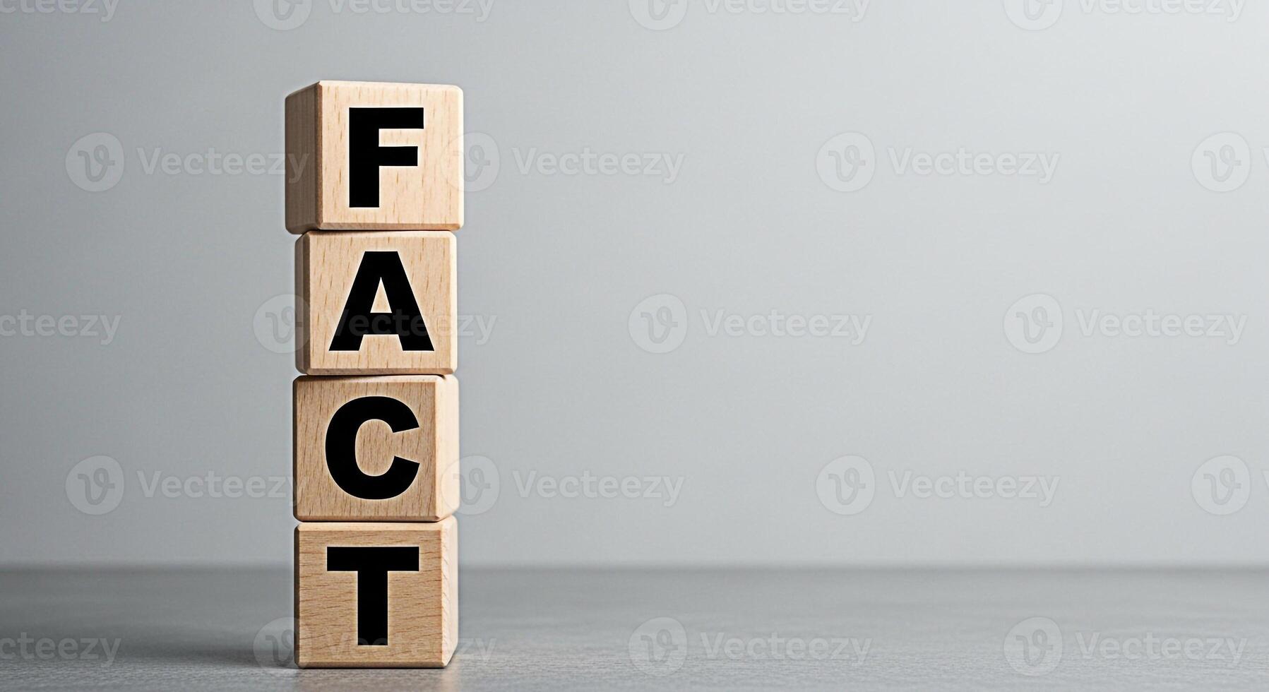 Wooden blocks spelling FACT stacked on a gray surface against a neutral background representing truth information and knowledge conveying a sense of accuracy and reliability in a clean and minimalist photo