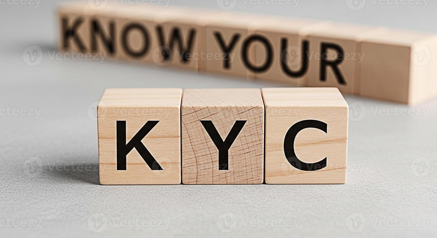 Wooden blocks spelling KYC Know Your Customer on a gray surface emphasizing compliance and identity verification in a financial setting conveying trust and security for banking and regulatory purposes photo
