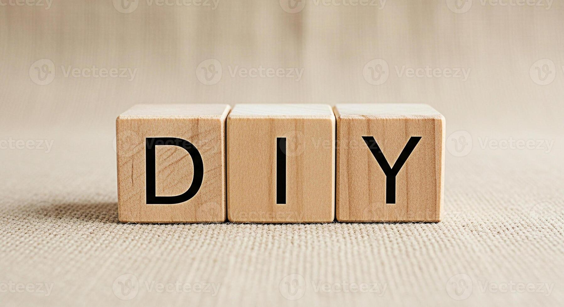 Wooden blocks spelling DIY on a burlap surface representing creativity and crafting suggesting a doityourself project with a sense of accomplishment and handmade artistry in a neutral setting photo