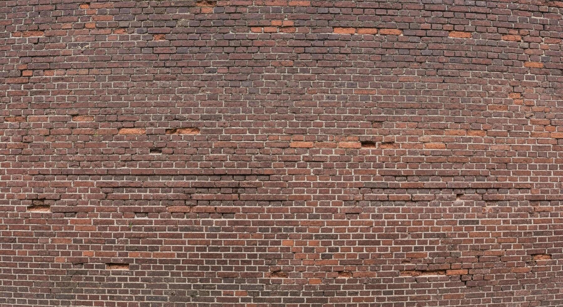 Rustic brick wall background with weathered texture offers warmth and depth for architectural renders and unique design projects photo