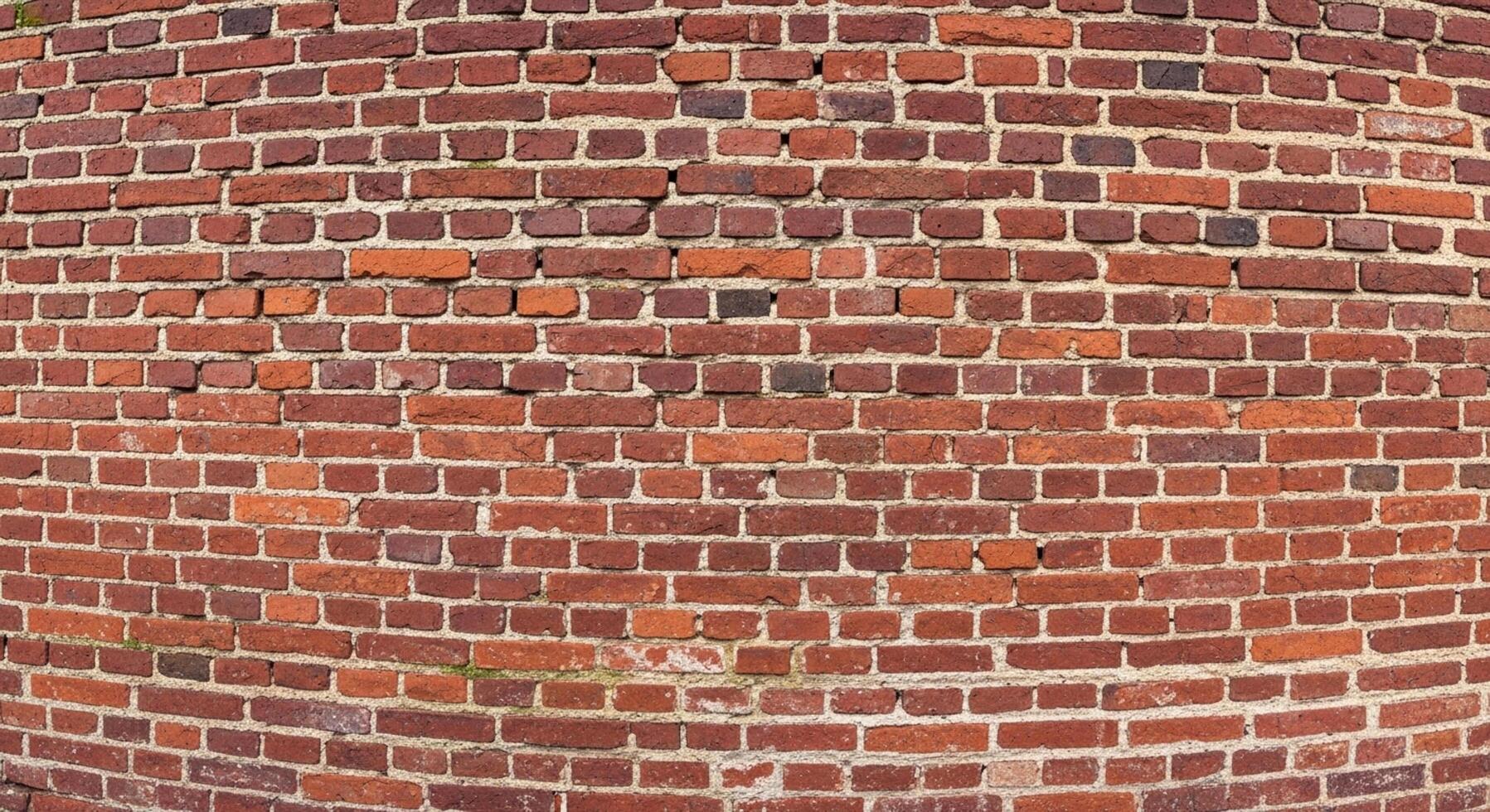 Rustic charm emanates from this vibrant red brick wall, ideal for backgrounds, textures, and adding a touch of vintage elegance to your design photo