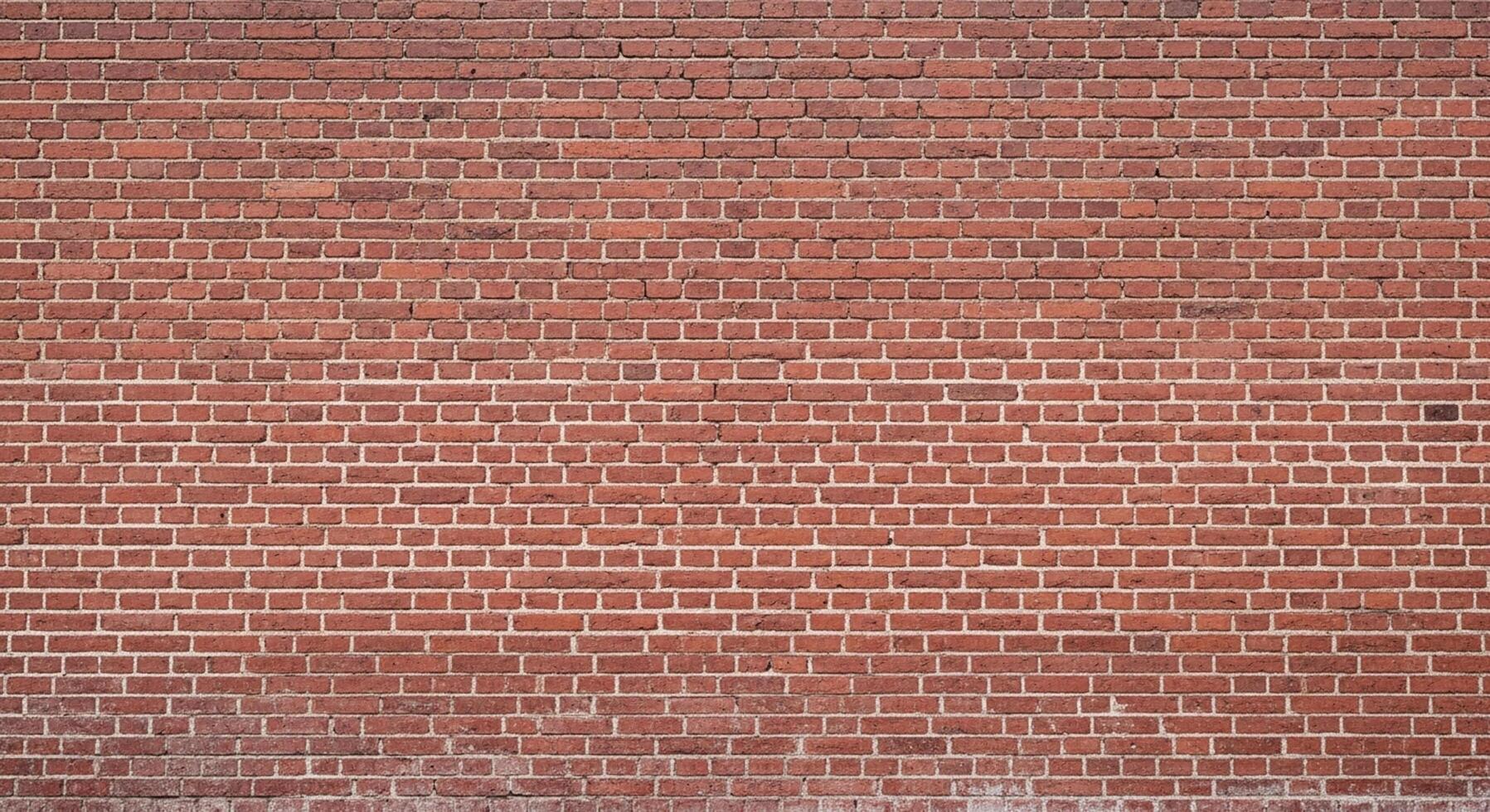 Authentic red brick wall texture provides a classic, durable, and visually appealing backdrop for any project photo