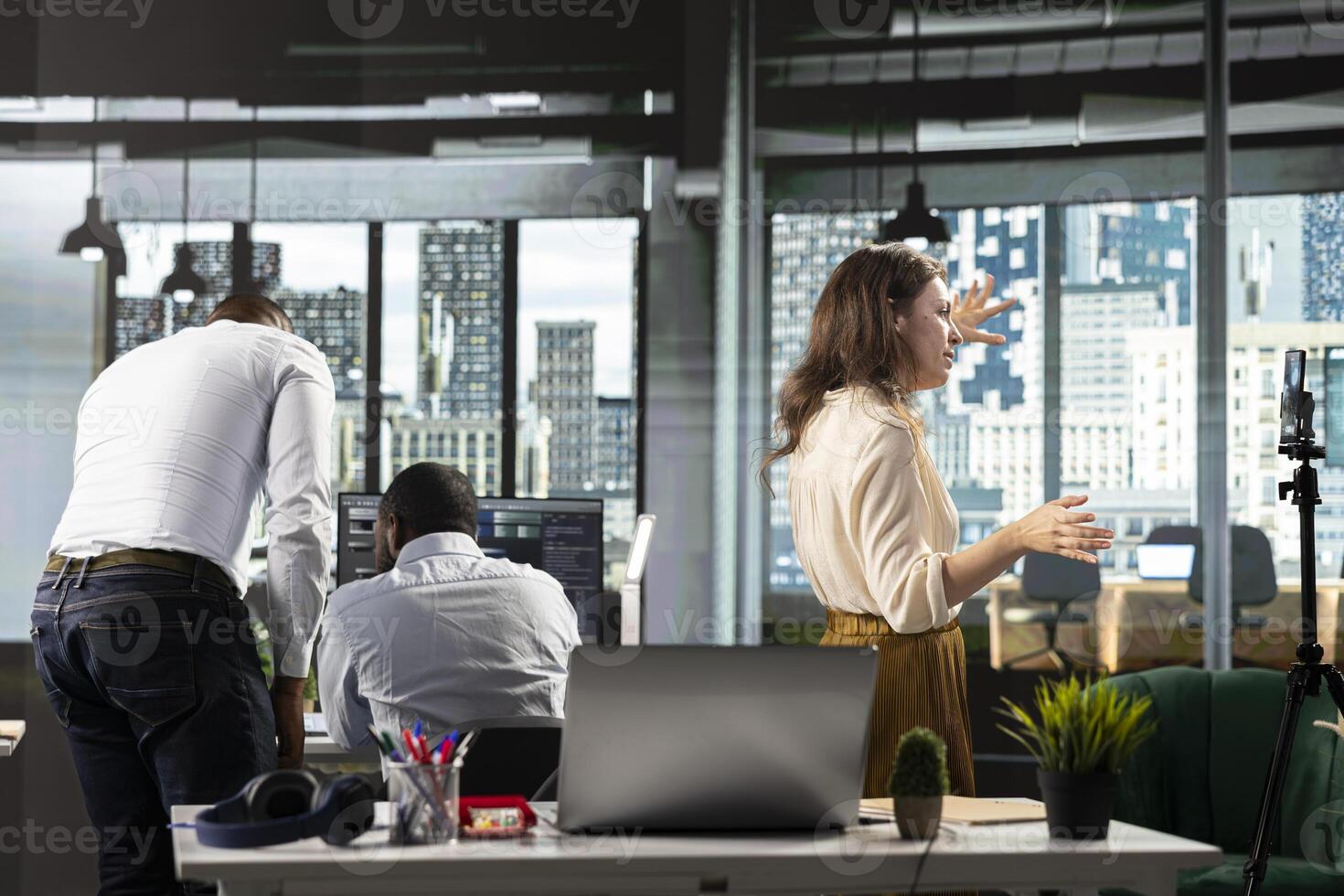 Business coworkers in modern office space sharing insights and reports, work team focuses on data visualization for efficient resource allocation. Successful company administration. photo