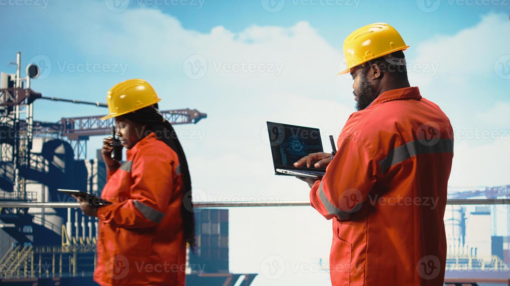 Offshore platform crew using artificial intelligence program on laptop to optimize drilling operations. African american coworkers analyzing geology data using AI tech on notebook, photo