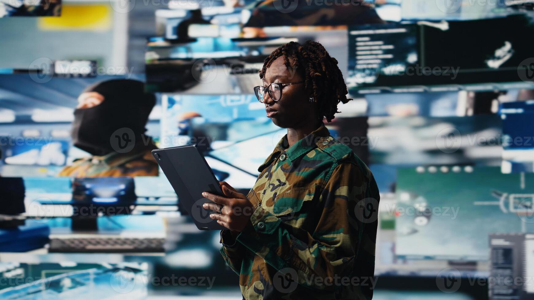 Air defense commander using radar systems on tablet app to detect incoming ballistic missiles. Army soldier in base of operations scanning enemy rockets using device application, camera A photo