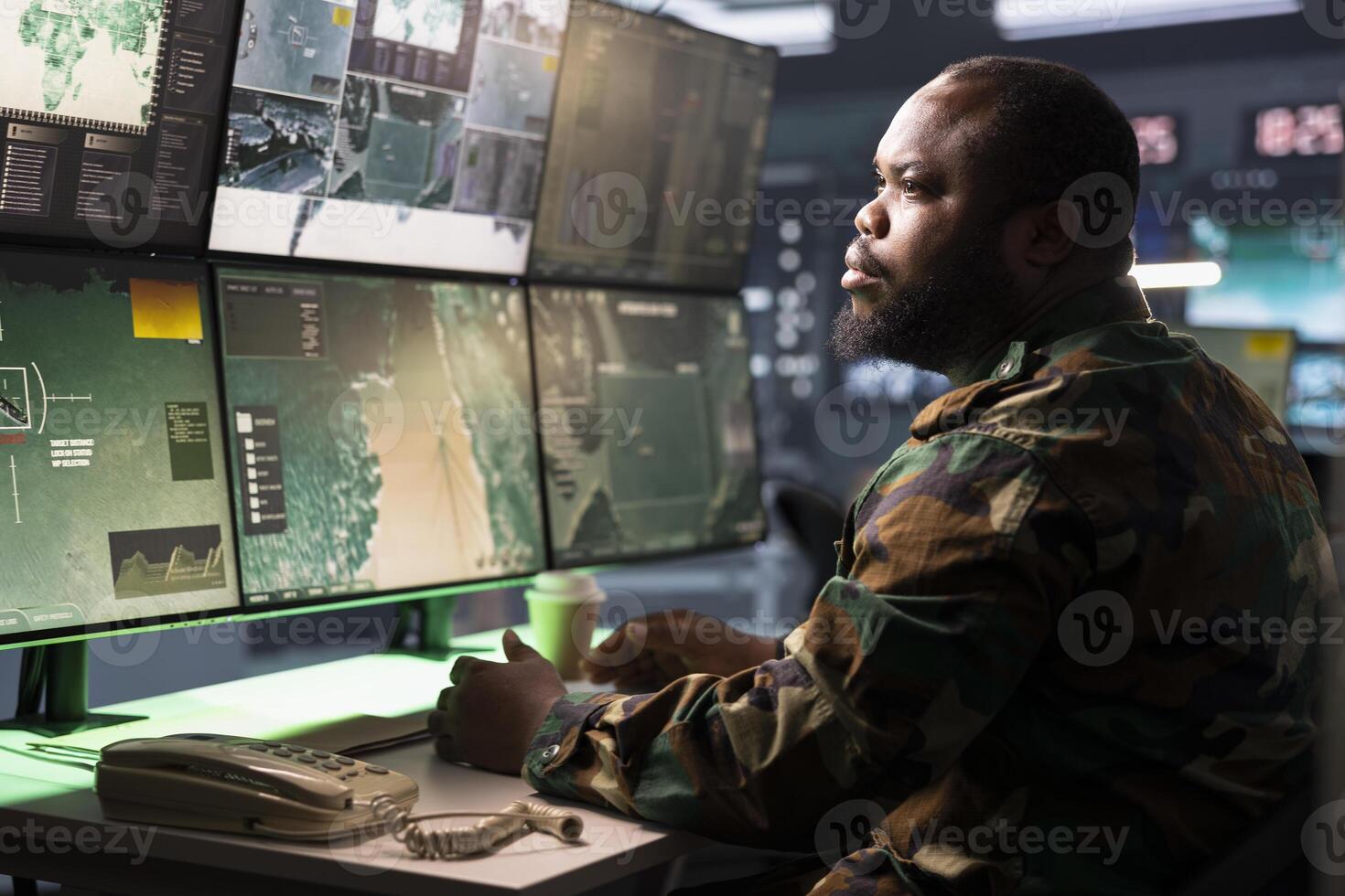 Counterintelligence agent in command center combating terrorism using detection system. Intelligence agency officer protecting national borders by tracking terrorists entering country photo