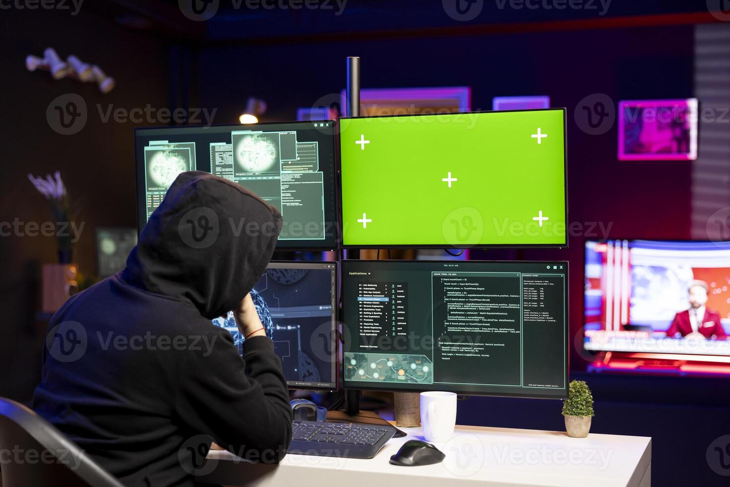 Cybercriminal coding on green screen PC, creating stealth malware that evades security. Hacker using chroma key computer to make script hiding malicious code from detection systems photo