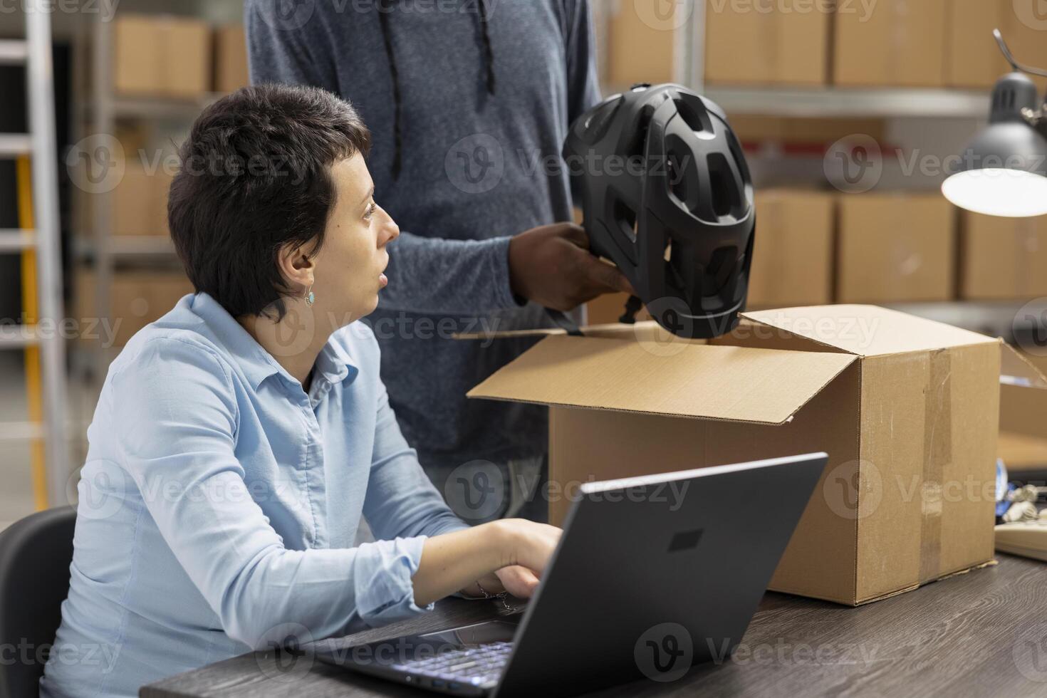 Diverse team checking order logistics for small business in house operations, small scale warehouse activity to ensure import export and distribution. Delivery service and inventory control. photo