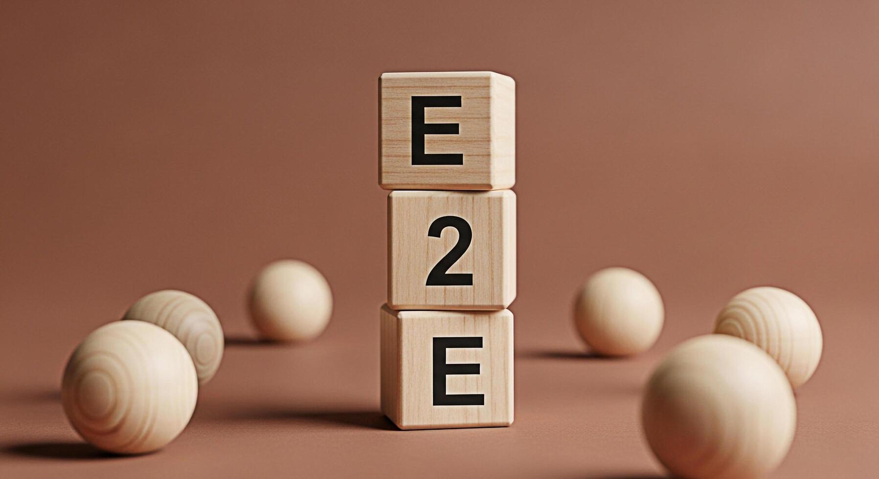 Wooden blocks spelling E2E stacked on a brown surface surrounded by wooden spheres representing endtoend encryption communication and data security in a minimalist and conceptual setting photo