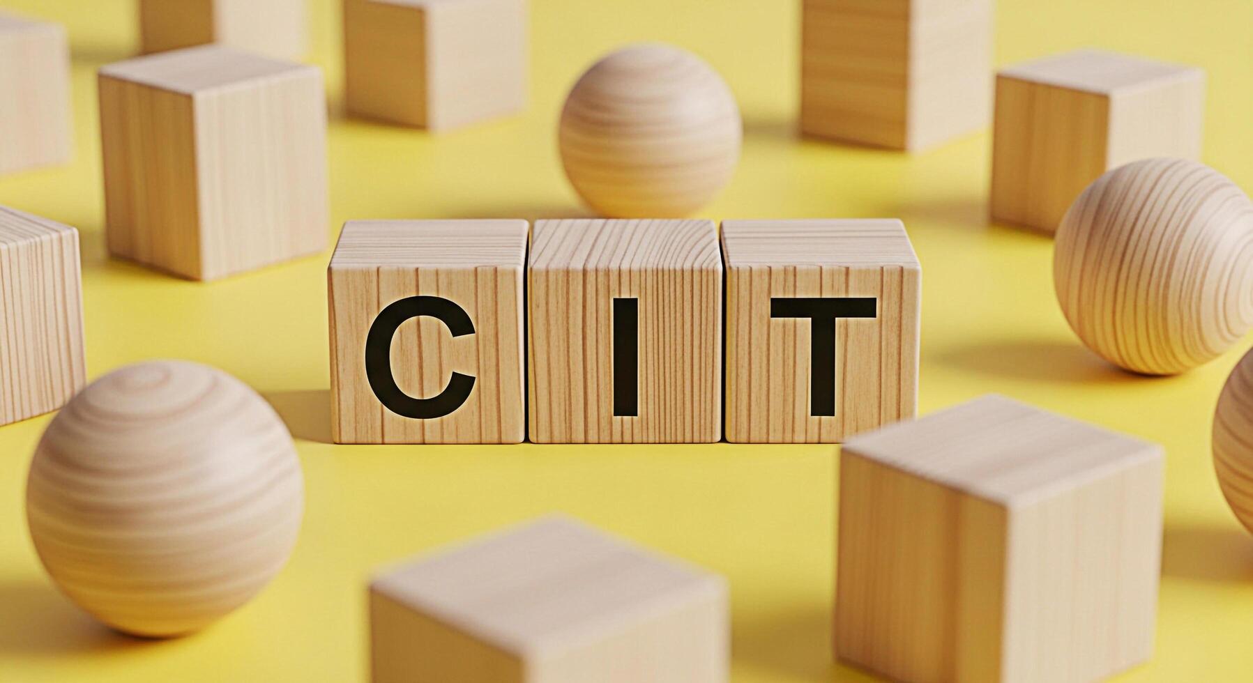 Wooden blocks spelling CIT on a yellow background representing computer information technology and innovation creating a modern and minimalist aesthetic for business and educational purposes photo