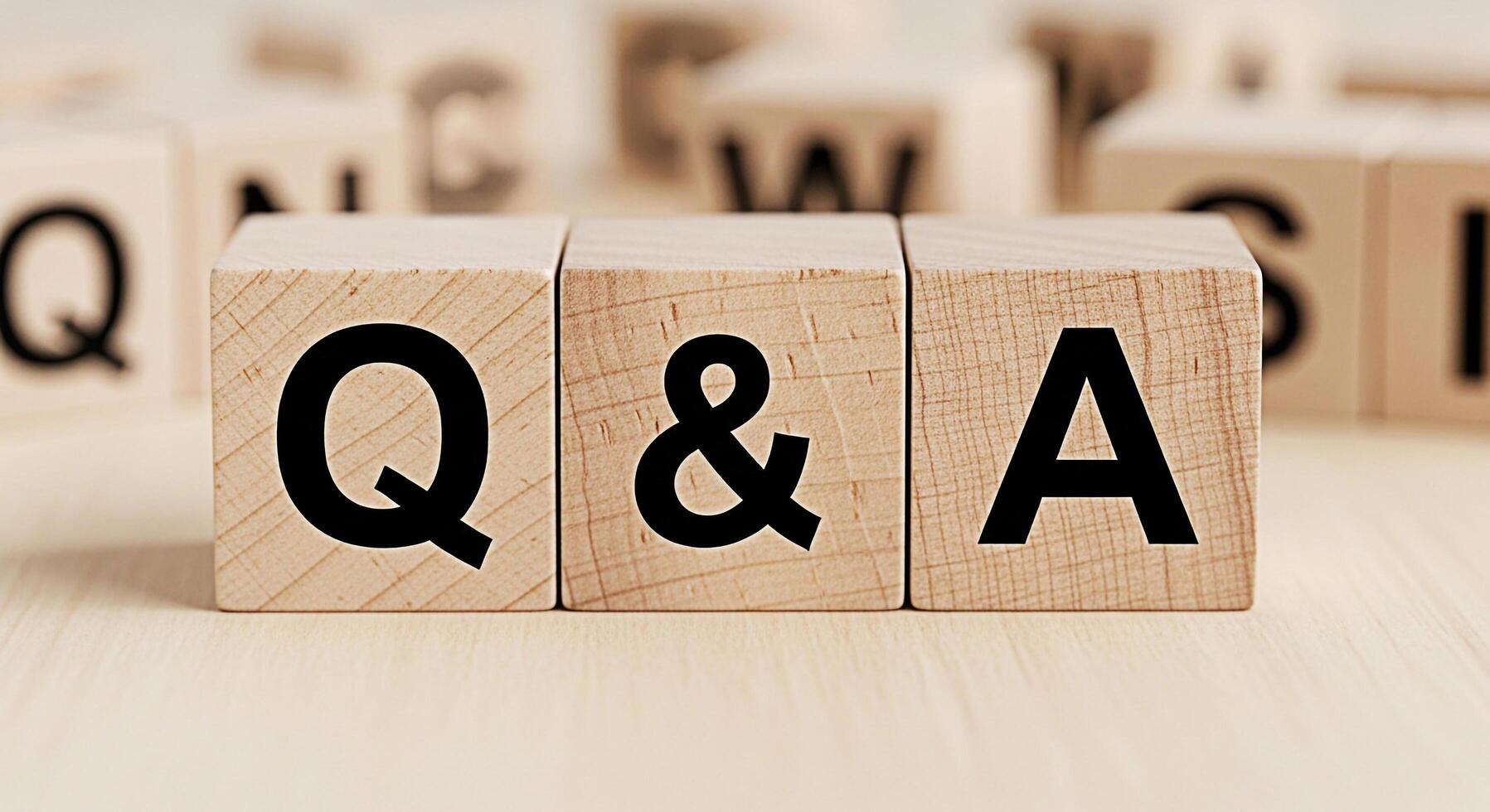 Wooden blocks displaying QA on a light wooden surface representing questions and answers knowledge sharing and information exchange in a simple and straightforward manner perfect for educational conte photo