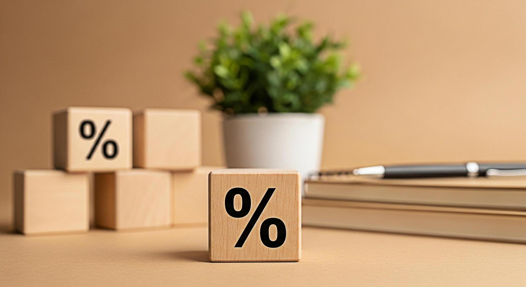 Wooden blocks displaying percentage signs on a desk with a notebook and pen representing financial rates and discounts in a business setting creating a sense of opportunity and savings photo