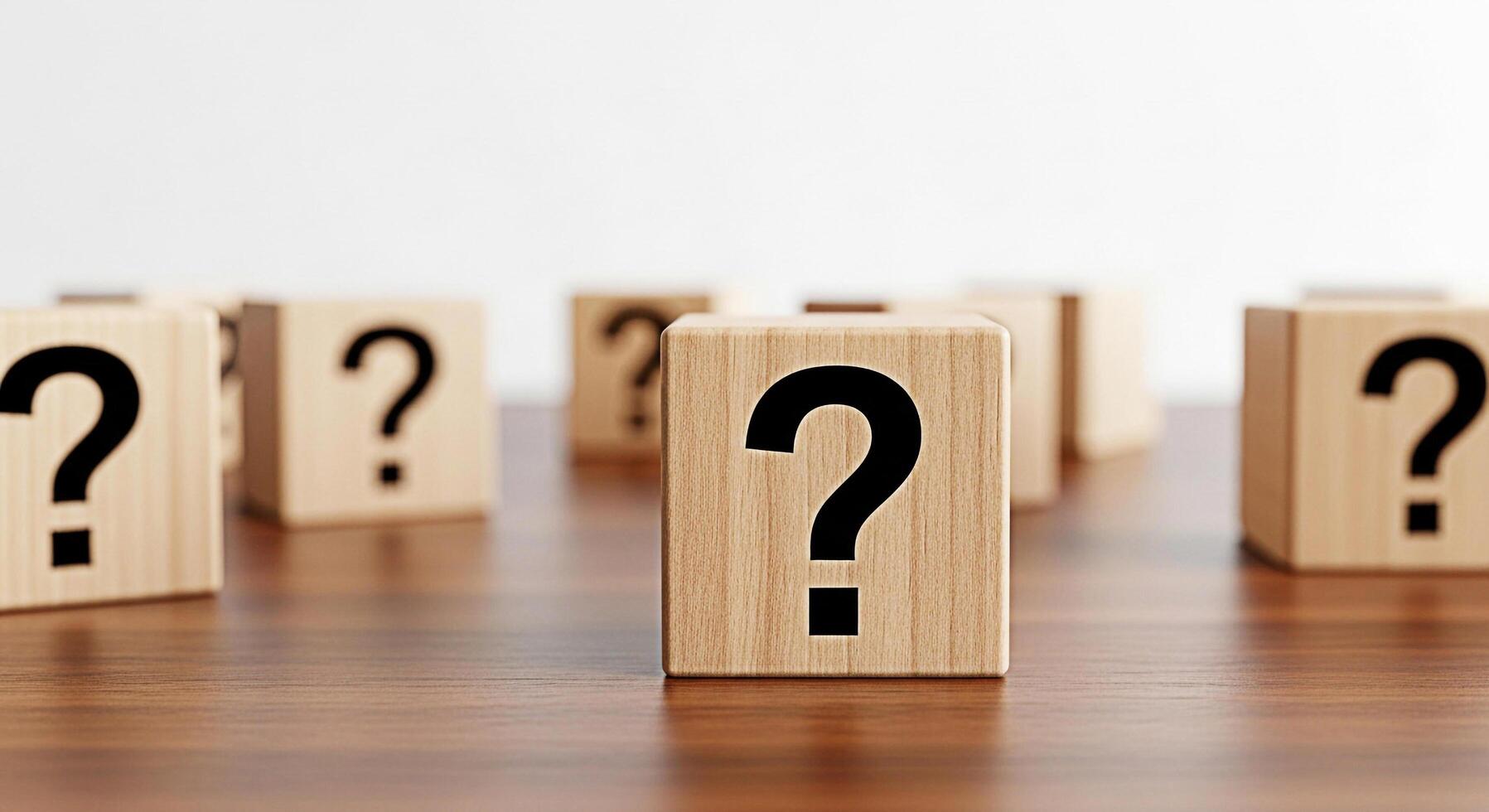 Wooden blocks displaying question marks on a wooden table symbolizing uncertainty and the need for answers in a business or educational setting creating a mood of curiosity and problemsolving photo