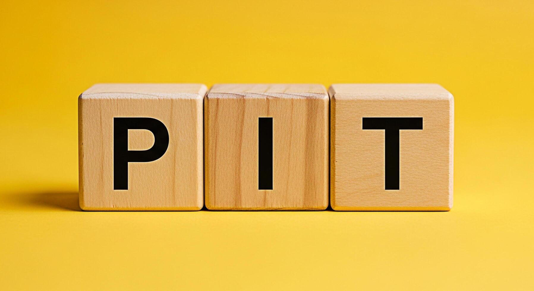 Wooden blocks spelling PIT on a vibrant yellow background representing the concept of challenges obstacles or difficult situations evoking a sense of overcoming adversity and finding solutions photo