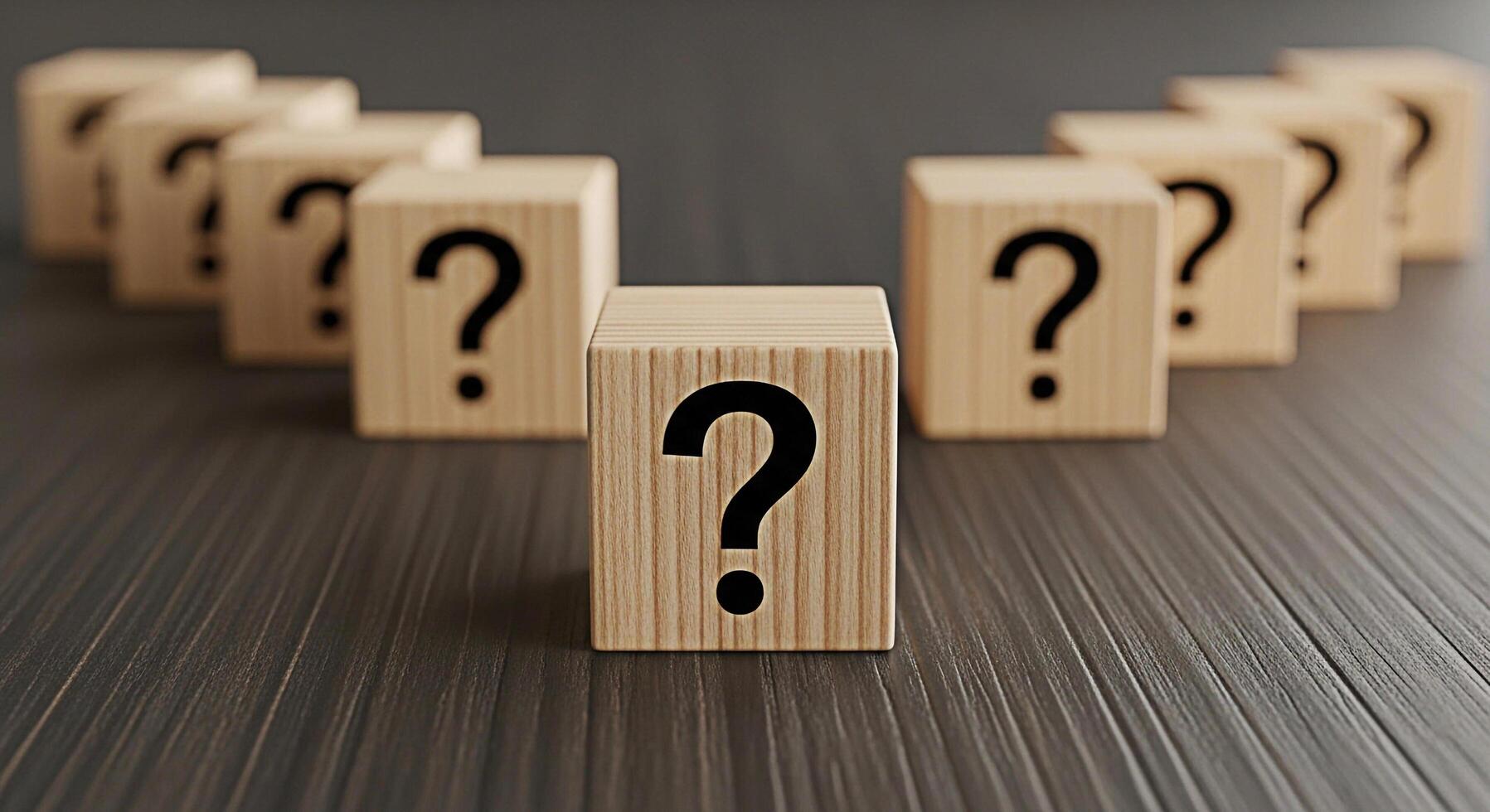 Wooden blocks displaying question marks on a dark wooden surface representing uncertainty and the need for answers in a business or personal context creating a sense of mystery and intrigue photo