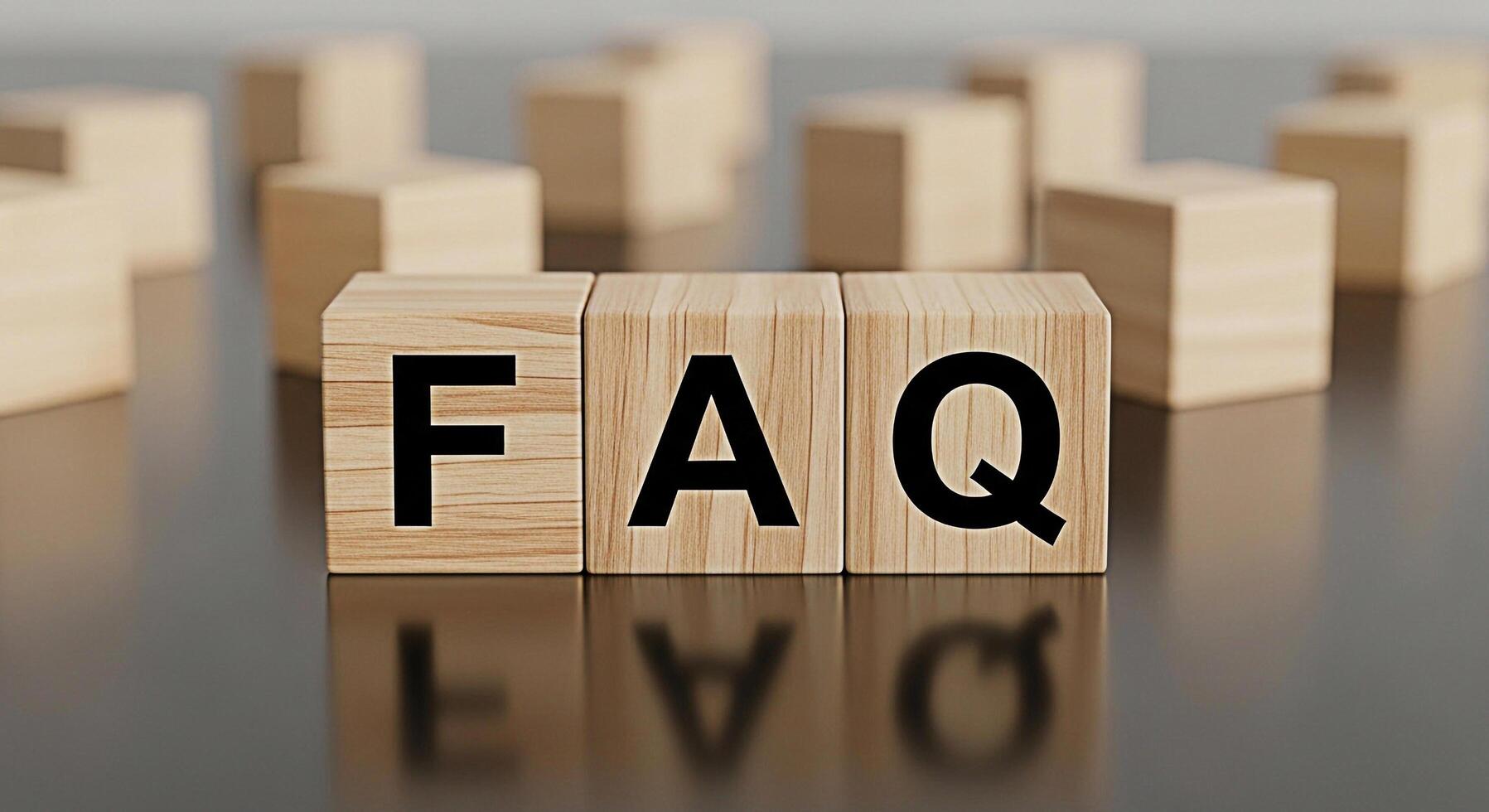 Wooden blocks spelling FAQ on a reflective surface representing frequently asked questions and information conveying clarity and support in a business or educational setting photo