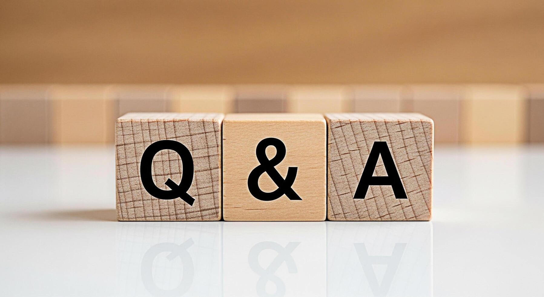 Wooden blocks displaying Q A on a white reflective surface representing questions and answers in a clear and concise manner fostering understanding and knowledge sharing photo
