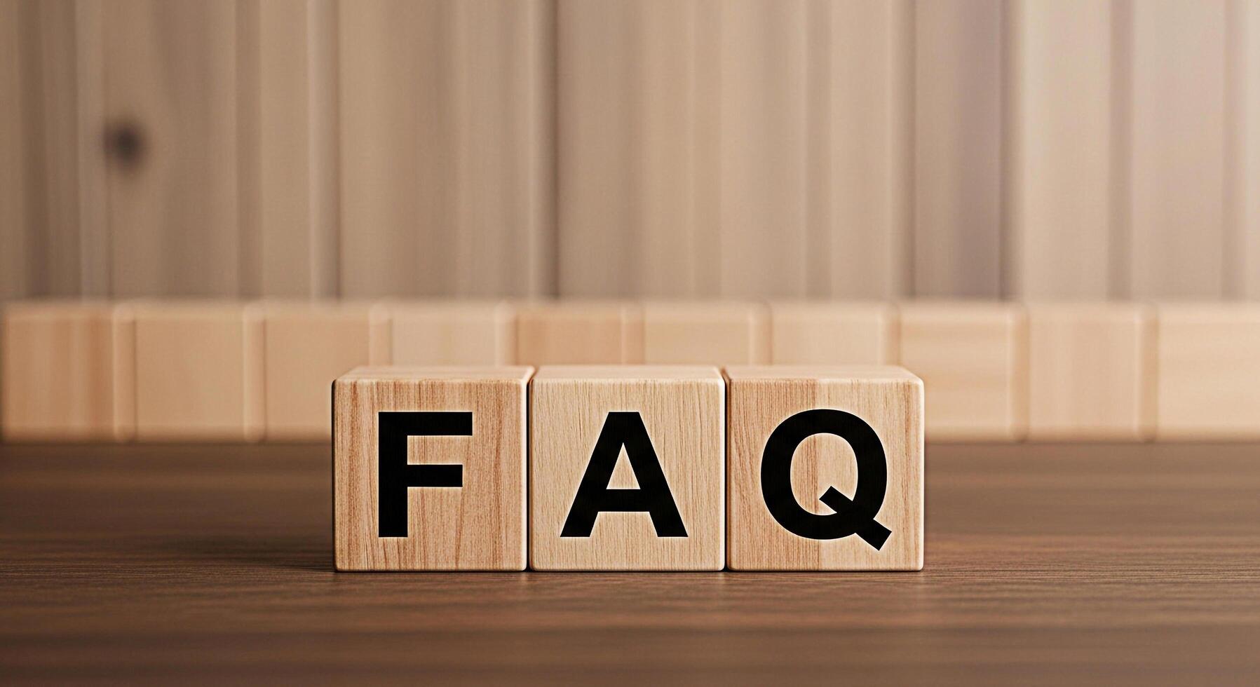 Wooden blocks displaying FAQ on a wooden surface representing frequently asked questions and information creating a sense of clarity and guidance for users seeking answers and support photo