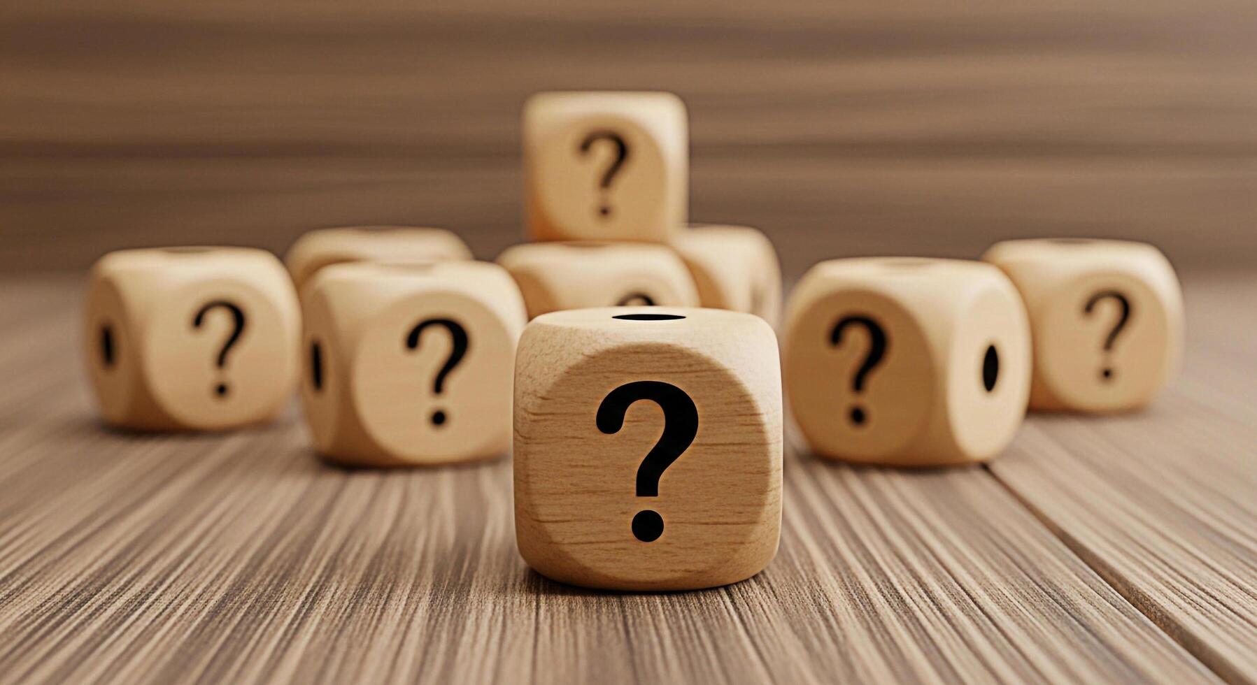 Wooden dice displaying question marks on a wooden surface representing uncertainty and the need for answers in a business or educational setting creating a thoughtful and inquisitive mood photo