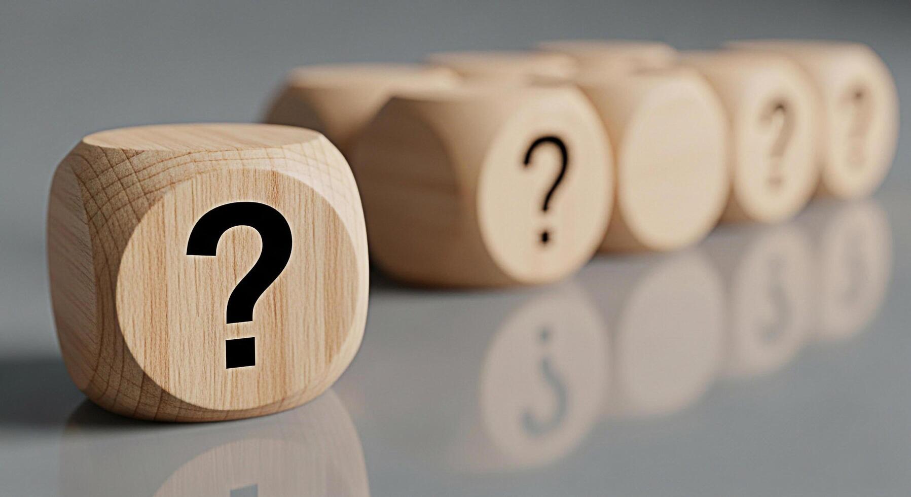 Wooden dice displaying question marks on a reflective surface representing uncertainty and the search for answers in a conceptual and thoughtprovoking composition perfect for illustrating problemsolvi photo