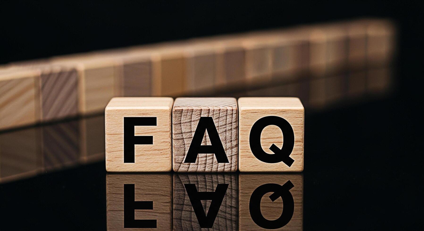 Wooden blocks displaying FAQ on a reflective surface illuminating common questions and answers creating a sense of clarity and guidance for information seekers in a modern minimalist setting photo