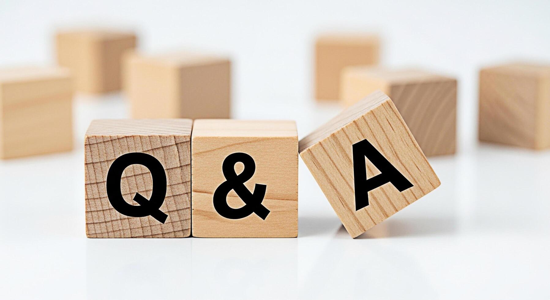 Wooden blocks displaying Q A on a white surface representing a question and answer session fostering clarity and understanding in a clean minimalist environment conveying a sense of knowledge and supp photo
