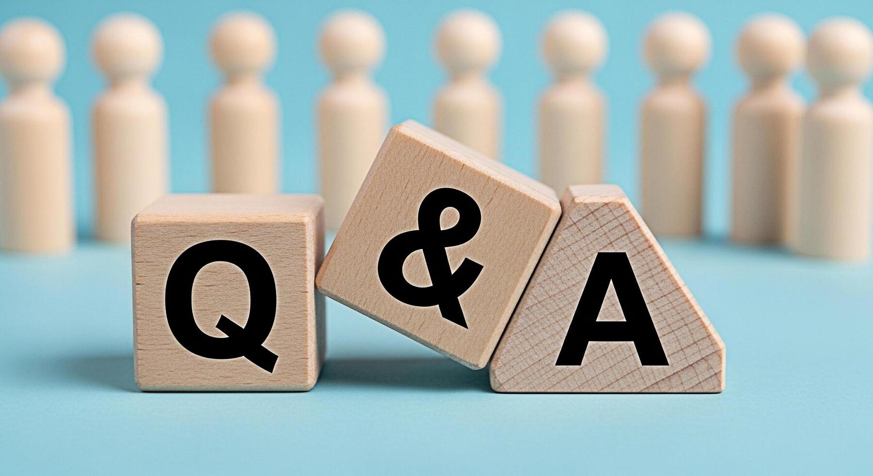 Wooden blocks displaying QA on a blue surface representing questions and answers in a business setting symbolizing knowledge sharing and problemsolving with a focus on collaboration and communication photo