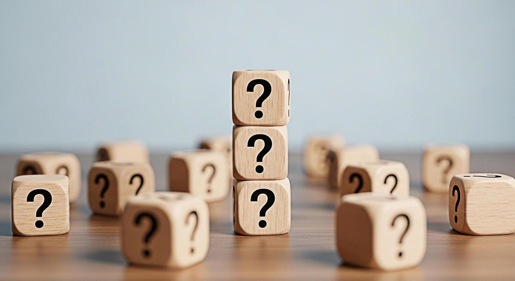 Stacked wooden blocks displaying question marks on a wooden surface representing uncertainty and the need for answers in a business or educational setting creating a sense of curiosity and challenge photo