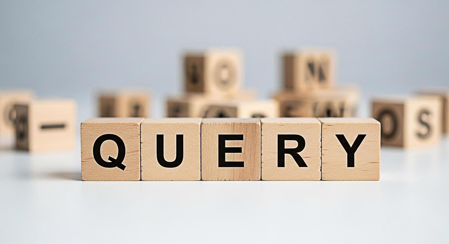 Wooden blocks spelling QUERY on a white surface representing information retrieval and search queries in a clean minimalist setting conveying a sense of clarity and focus on finding answers photo