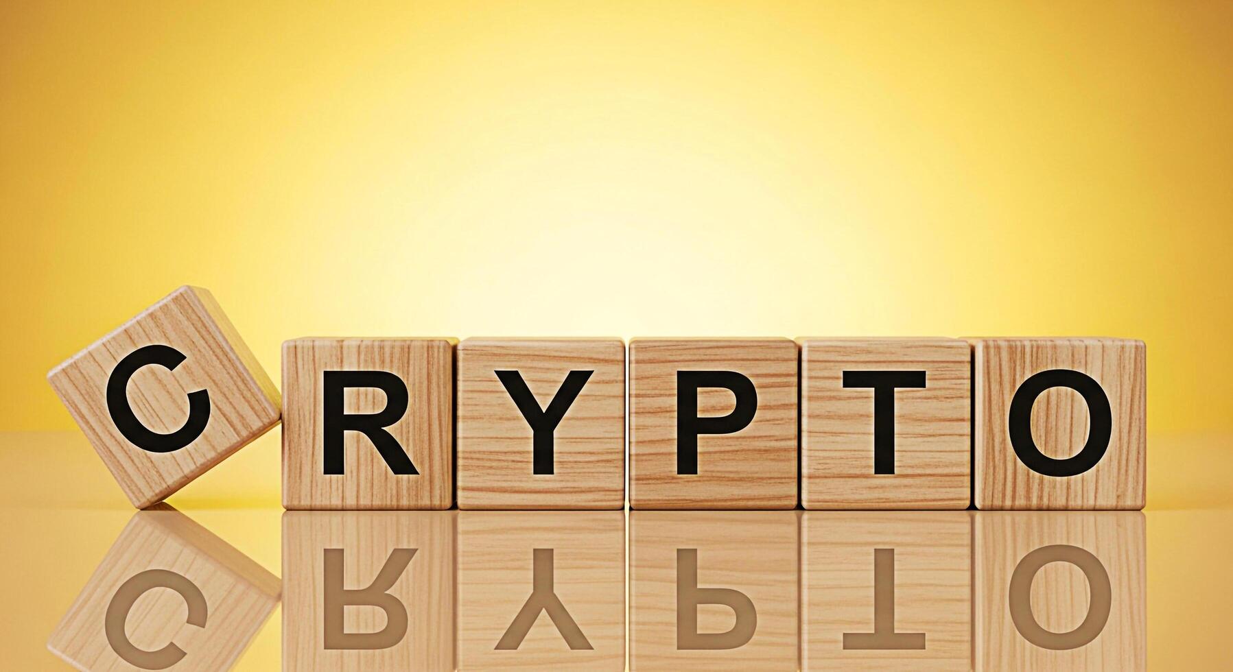 Wooden blocks spelling CRYPTO on a reflective surface against a golden background representing digital currency blockchain technology and the future of finance with a modern and innovative feel photo