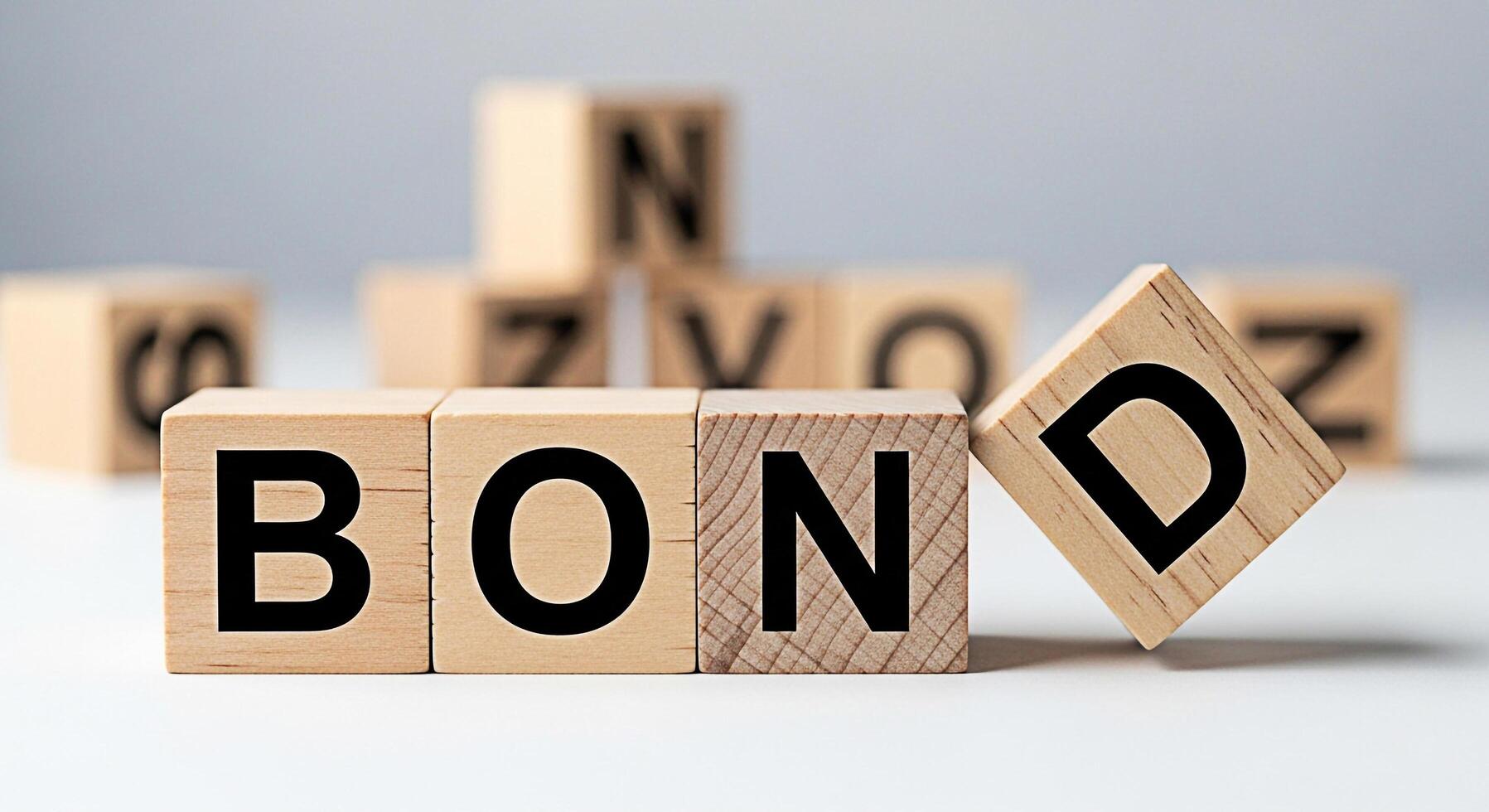 Wooden blocks spelling BOND on a white surface with the D block tilting representing financial security connection and investment in a stable and reliable environment photo
