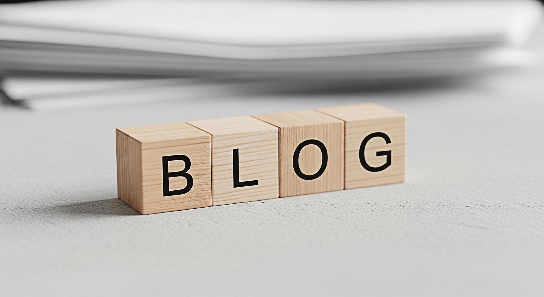 Wooden blocks spelling BLOG on a textured surface suggesting a digital platform for sharing ideas and information in a clean minimalist setting conveying a sense of modern communication photo