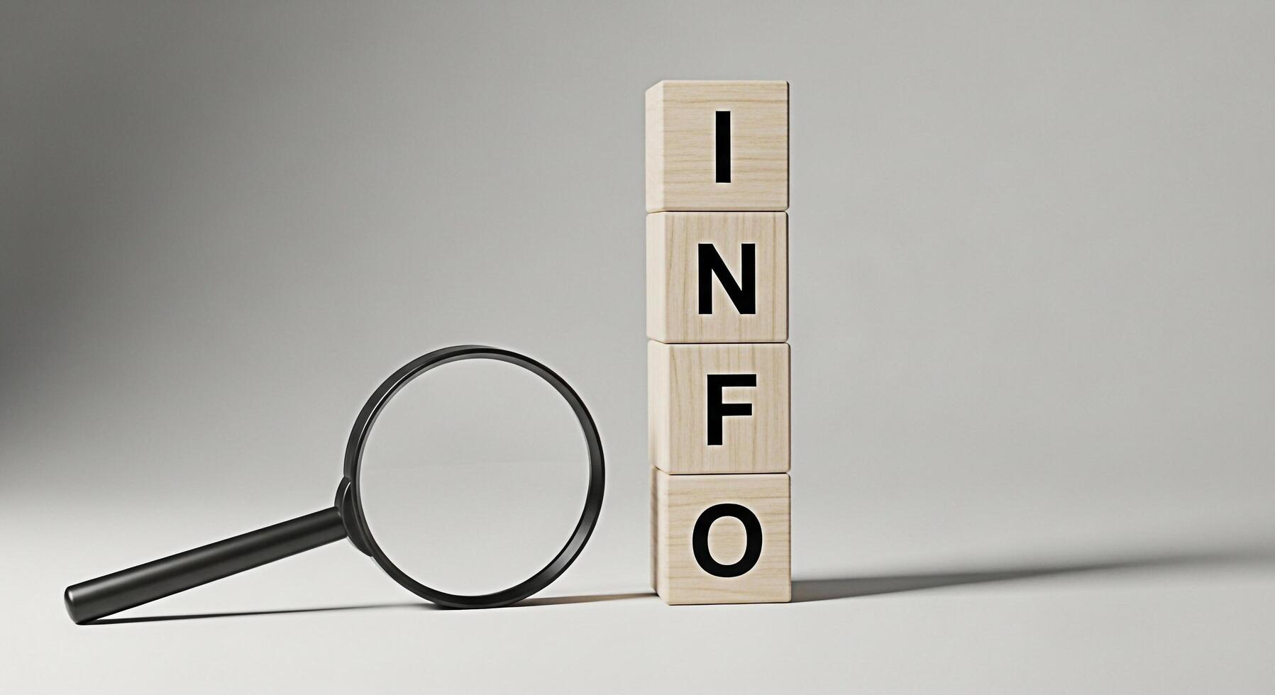 Magnifying glass examining wooden blocks spelling out INFO in a neutral setting representing information discovery research and the importance of data analysis for informed decisionmaking photo
