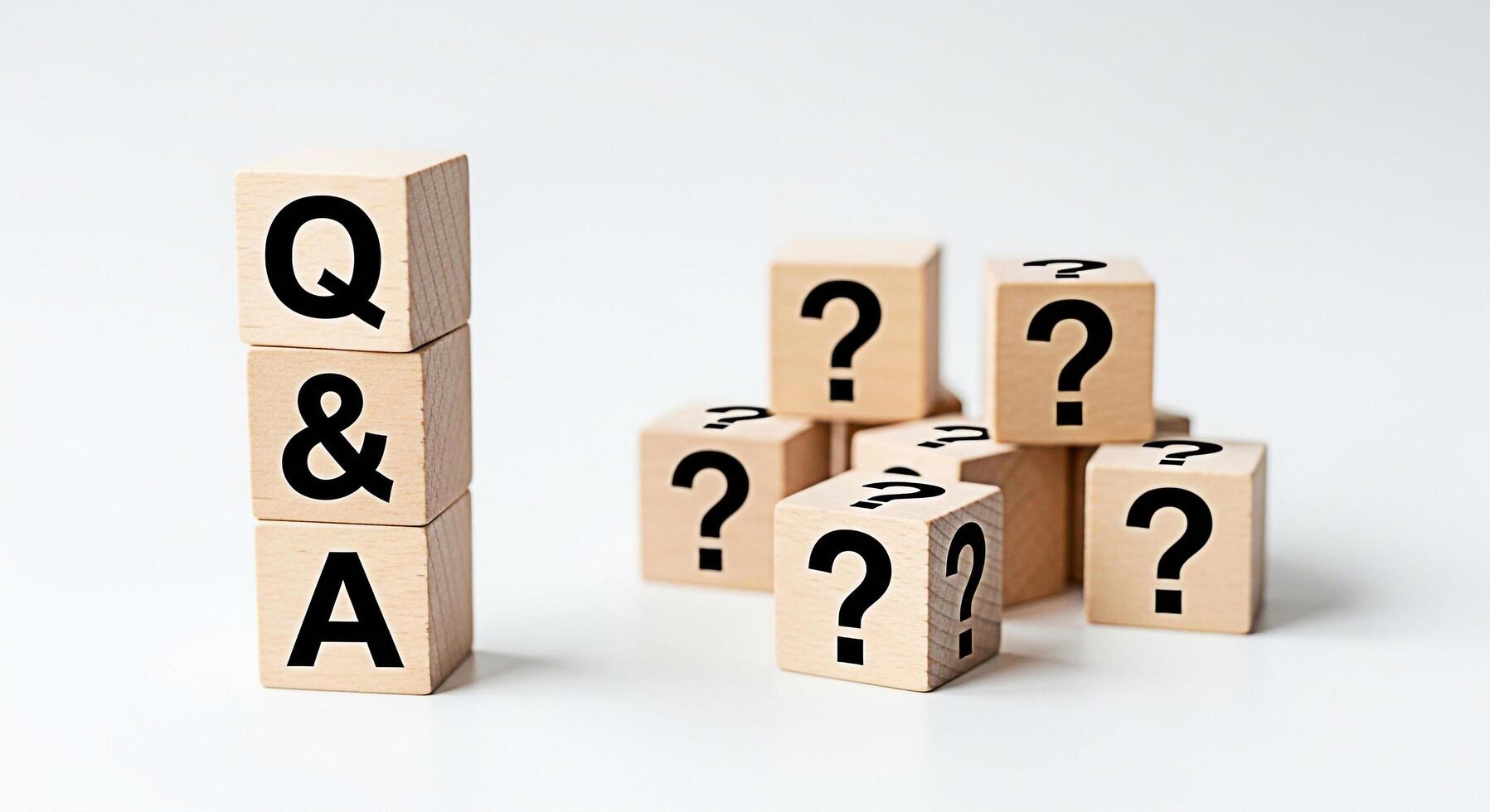 Wooden blocks displaying QA and question marks on a white surface symbolizing inquiry and knowledgeseeking in a minimalist setting fostering curiosity and problemsolving perfect for educational or bus photo