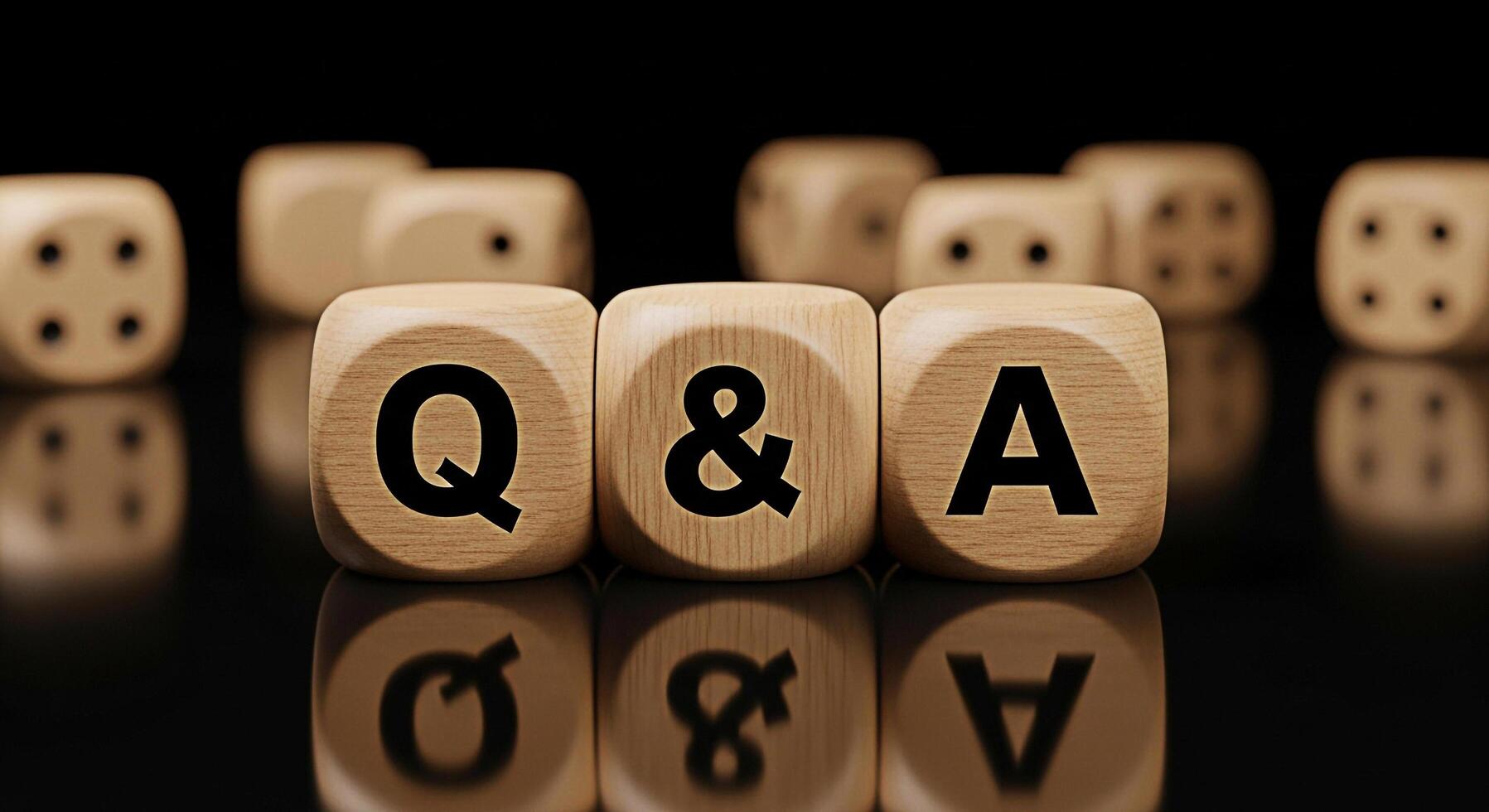 Wooden dice spelling out Q A sitting on a reflective black surface representing questions and answers knowledge and the importance of information in a clear and concise manner photo
