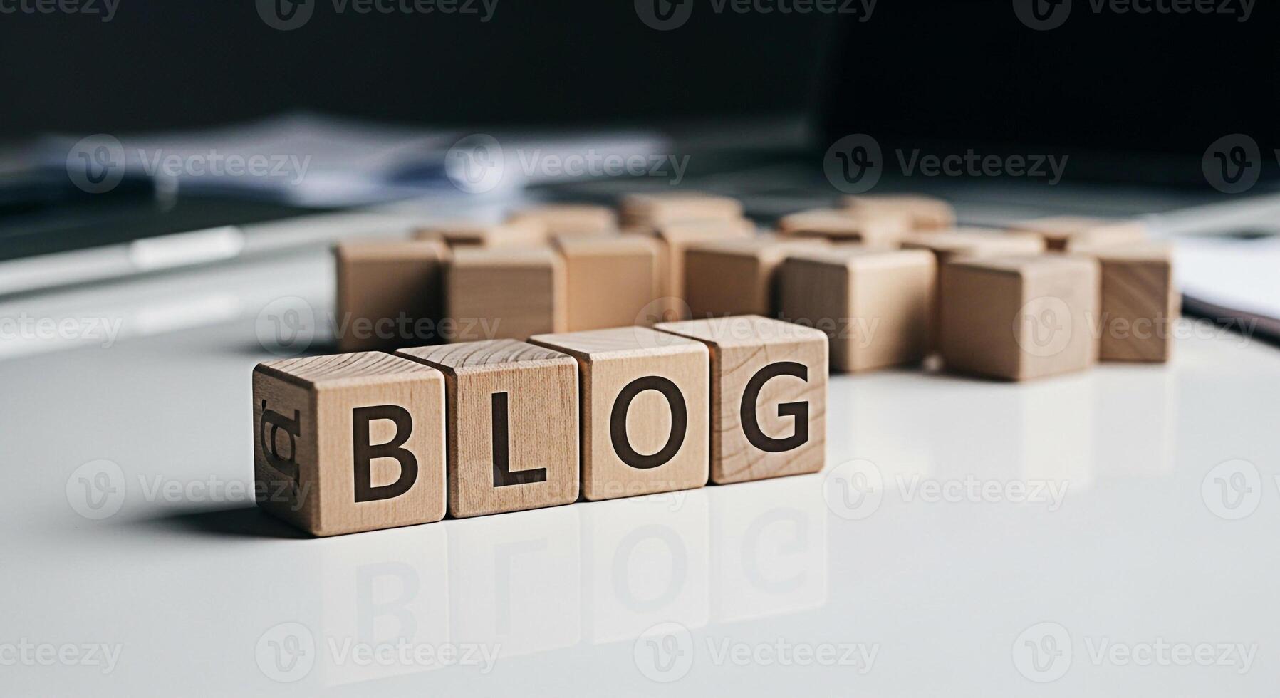Wooden blocks spelling BLOG on a white desk reflecting light symbolizing online content creation and the importance of blogging in a modern digital environment conveying a clean and professional aesth photo