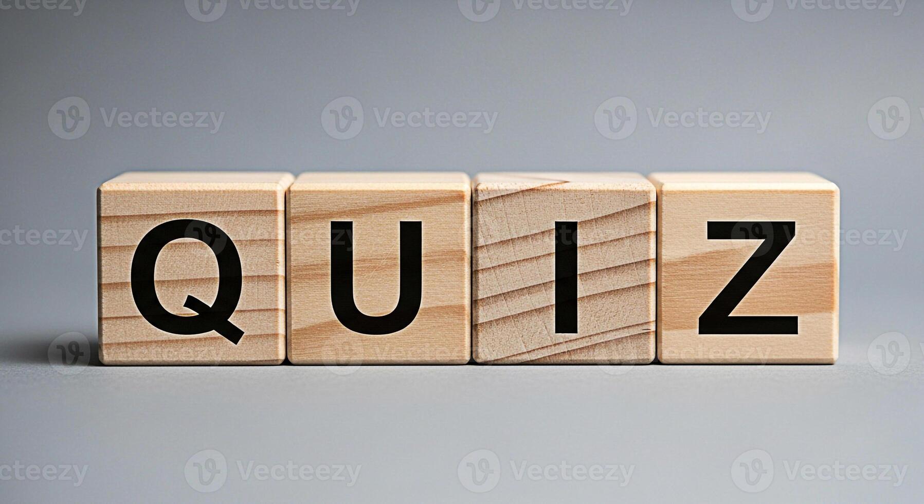 Wooden blocks spelling QUIZ on a gray surface representing a test of knowledge and skills creating an atmosphere of challenge and intellectual stimulation in an educational setting photo