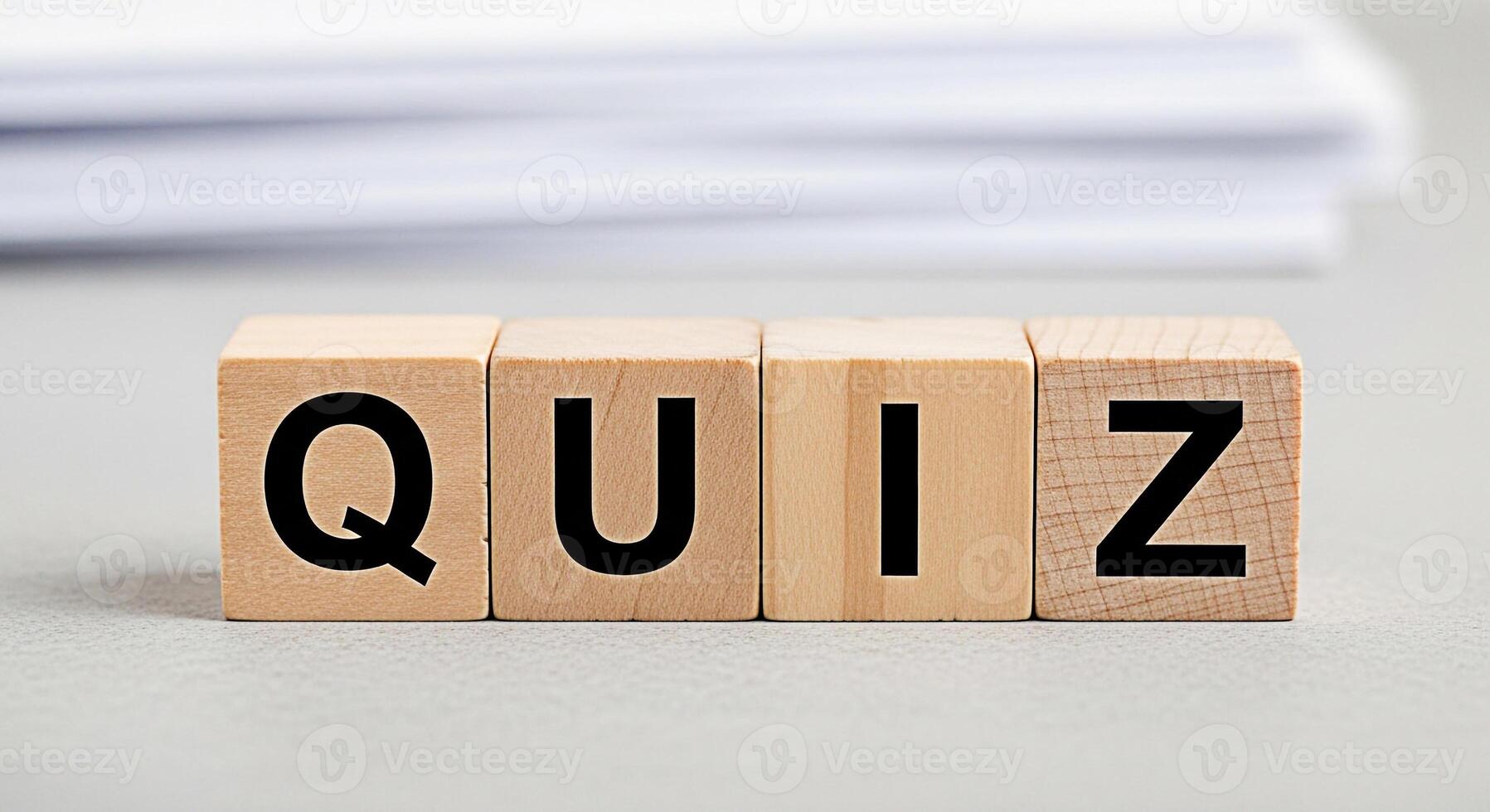 Wooden blocks spelling QUIZ on a neutral surface representing knowledge assessment and intellectual challenge in an educational setting fostering curiosity and engagement photo