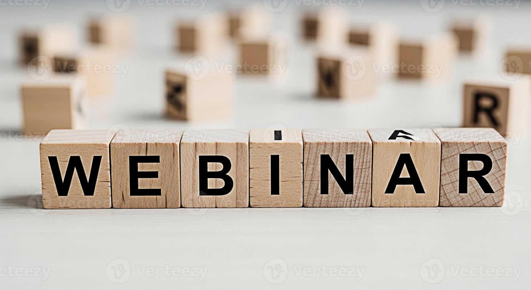 Wooden blocks spelling Webinar on a white surface promoting online education and business training conveying a message of learning and professional development in a clean minimalist setting photo