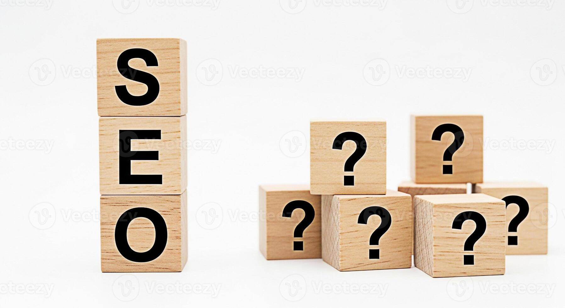 Wooden blocks spelling SEO stand tall while other blocks with question marks cluster around symbolizing the challenges and uncertainties of search engine optimization in a competitive digital landscap photo